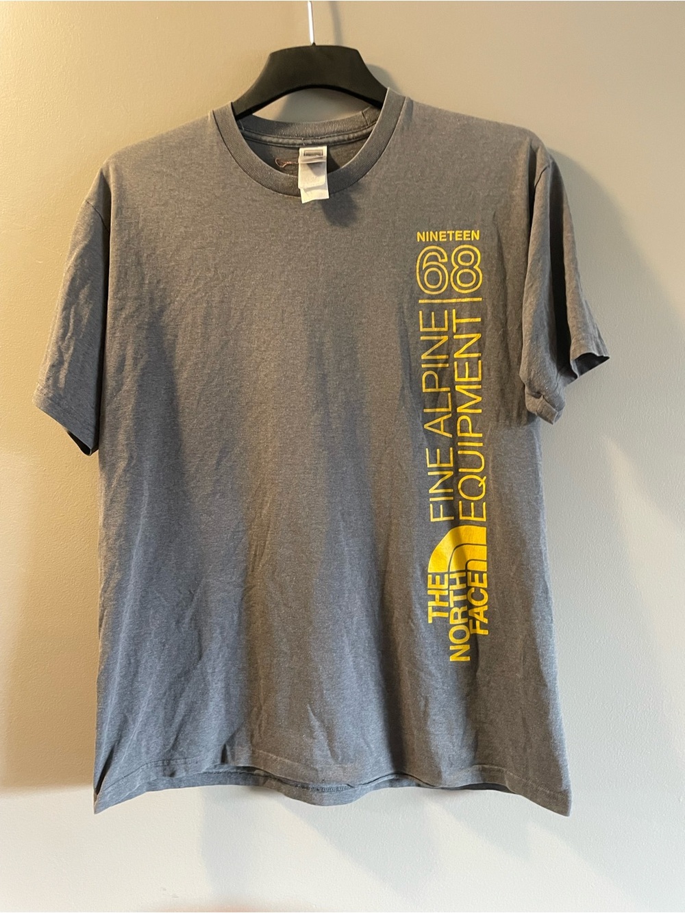 The North Face Men’s Gray T-Shirt with Yellow Vertical Logo